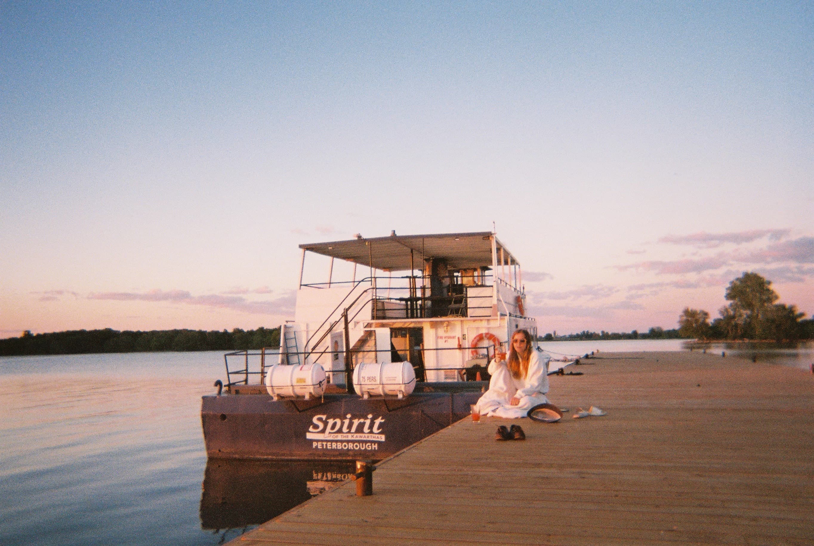Gillian lounging on a dock